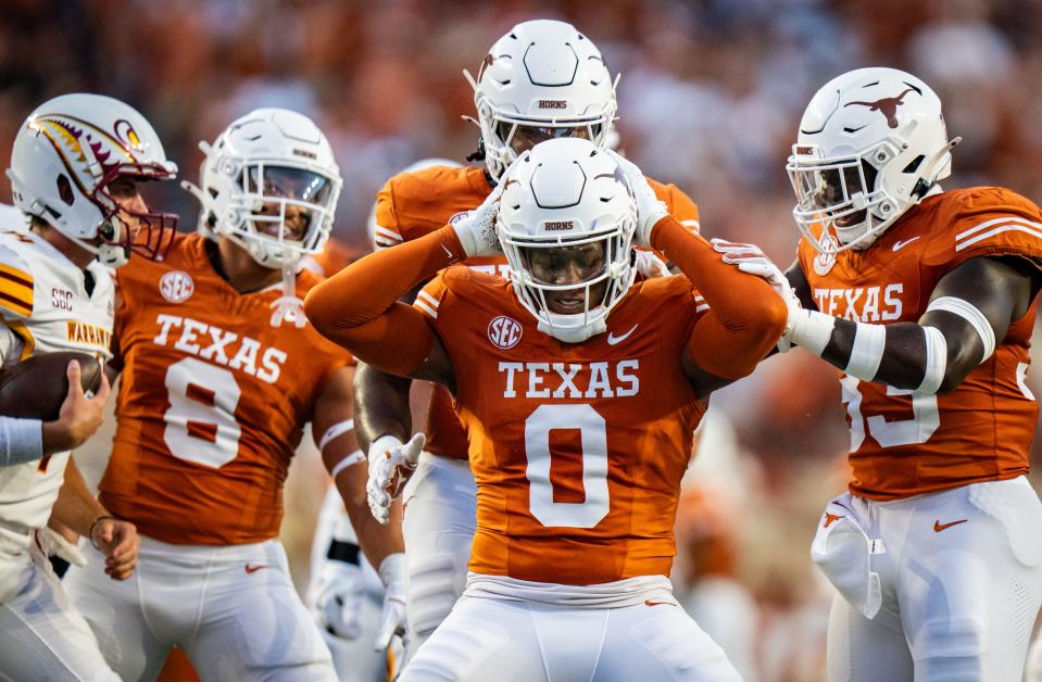 Texas Longhorns linebacker Anthony Hill Jr. (0) celebrates sacking Louisiana Monroe Warhawks quarterback General Booty (14) in the first half of the Texas Longhorns' game against the ULM Warhawks at Darrell K Royal Texas Memorial Stadium in Austin, Sept. 21, 2024.