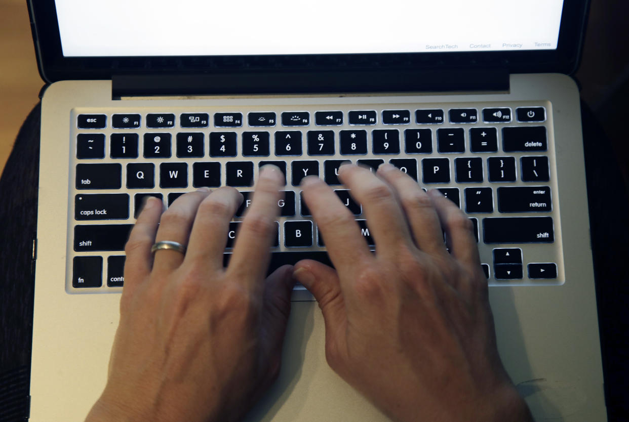 This Monday, June 19, 2017, photo shows fingers on laptop keyboard in North Andover, Mass. The Equifax breach not only exposed sensitive personal information of 143 million Americans, but it also underscored the huge and largely unaddressed vulnerabilities that make widespread identity theft possible. Experts have warned for years that the widespread use of Social Security numbers, lax corporate security and even looser individual password practices could lead to an identity-theft apocalypse. (AP Photo/Elise Amendola)