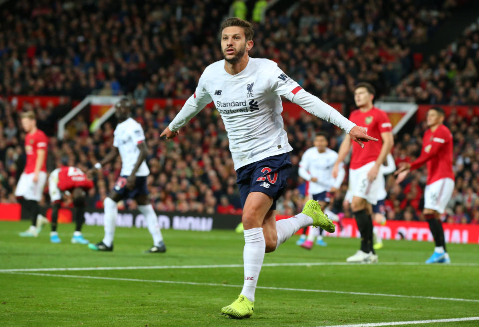 MANCHESTER, ENGLAND - OCTOBER 20: Adam Lallana of Liverpool celebrates after scoring his sides first goal during the Premier League match between Manchester United and Liverpool FC at Old Trafford on October 20, 2019 in Manchester, United Kingdom. (Photo by Alex Livesey/Getty Images)