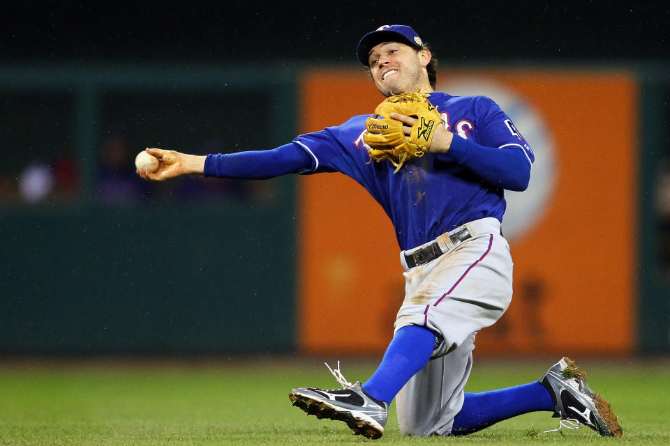 ST LOUIS, MO - OCTOBER 19: Ian Kinsler #5 of the Texas Rangers fields a ball in the eighth inning during Game One of the MLB World Series against the St. Louis Cardinals at Busch Stadium on October 19, 2011 in St Louis, Missouri. (Photo by Dilip Vishwanat/Getty Images)