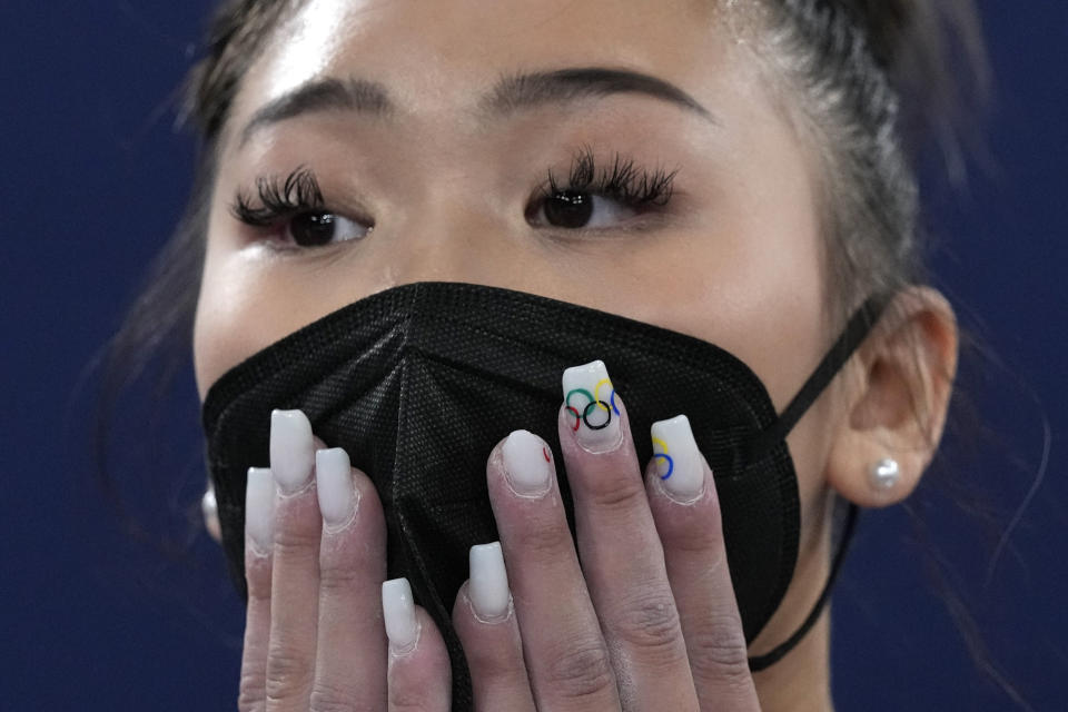 Sunisa Lee, of the United States, waits for the final results of the artistic gymnastics women's all-around final at the 2020 Summer Olympics, Thursday, July 29, 2021, in Tokyo. (AP Photo/Gregory Bull)