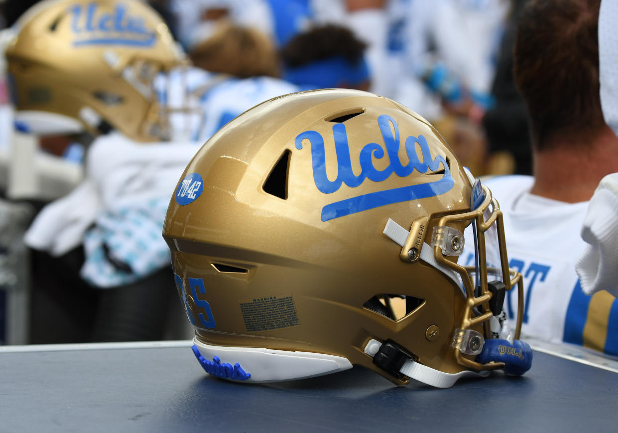 EUGENE, OR - OCTOBER 22: A UCLA Bruins helmet sits on a sideline equipment box during a PAC-12 Conference college football game between the UCLA Bruins and Oregon Ducks on October 22, 2022 at Autzen Stadium in Eugene, Oregon. (Photo by Brian Murphy/Icon Sportswire via Getty Images)
