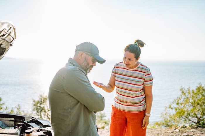 two people talking to each other outside