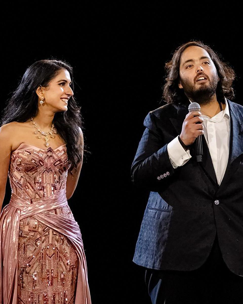 Anant Ambani and his bride-to-be Radhika Merchant are pictured.