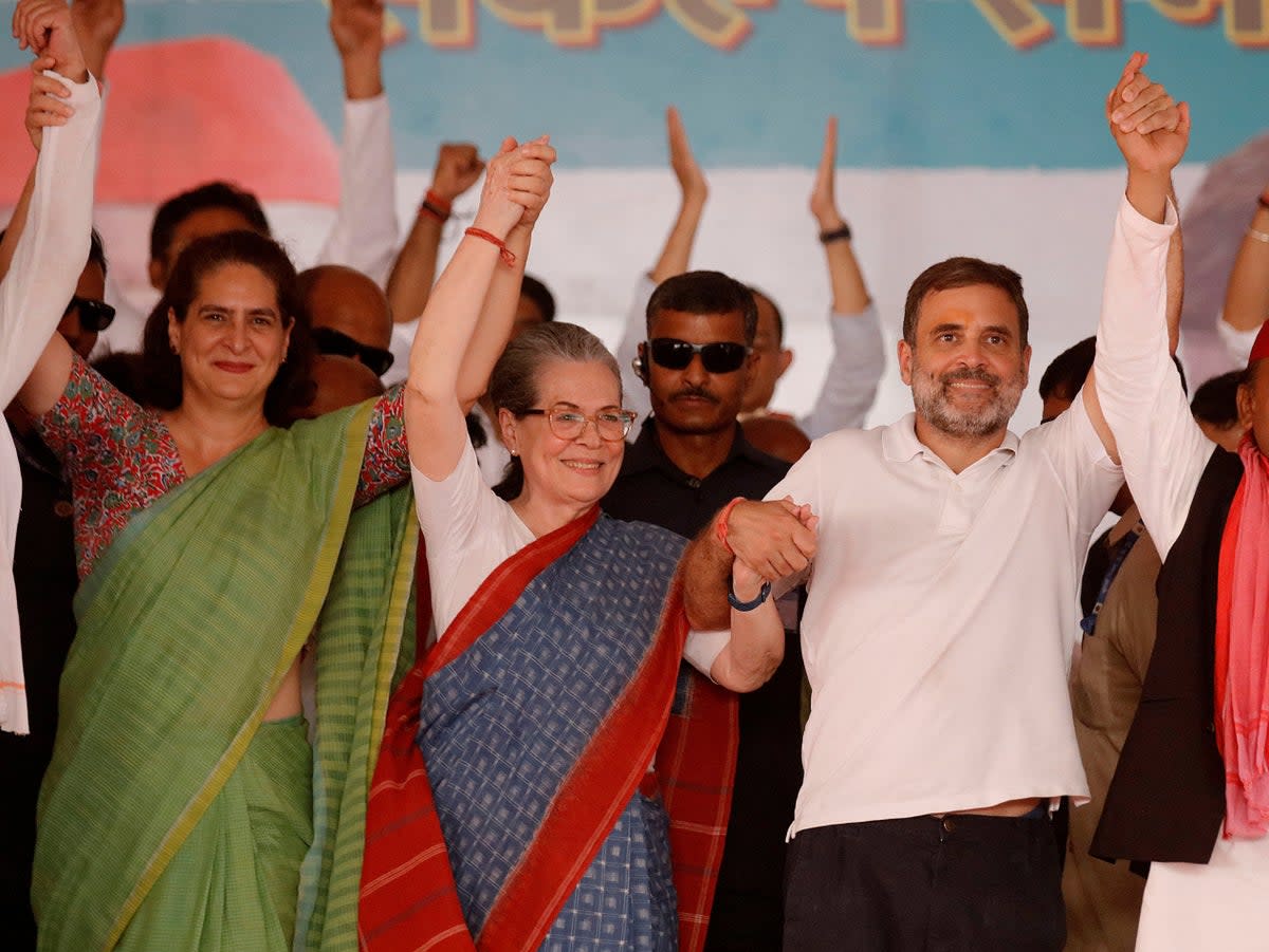 Left to right: Priyanka Gandhi-Vadra, Sonia Gandhi and Rahul Gandhi at an election campaign rally in Rae Bareli (Reuters)