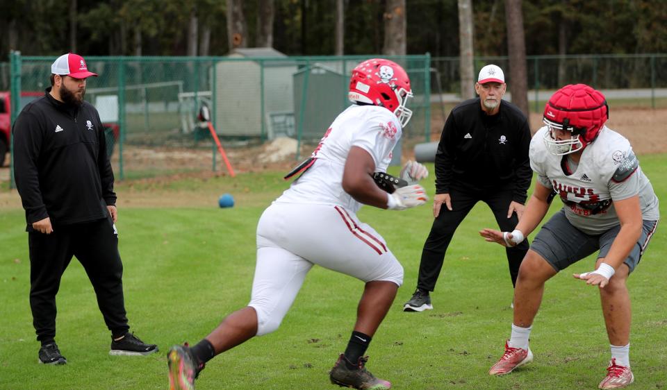 Savannah Christian coaches Caleb and Kempie Womble watch linemen run through drills during practice on Tuesday, November 14, 2023.