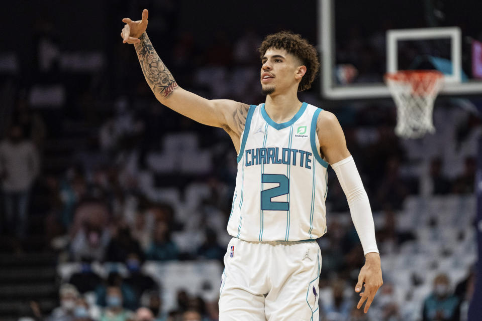 Charlotte Hornets guard LaMelo Ball gestures after making a 3-point shot against the Indiana Pacers during the first half of an NBA basketball game in Charlotte, N.C., Wednesday, Oct. 20, 2021. (AP Photo/Jacob Kupferman)