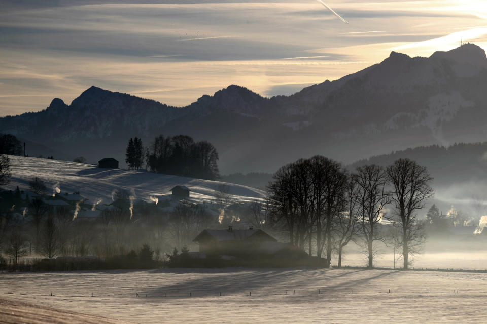 Morning fog hangs over a valley at the Alps near Miesbach, Germany, Wednesday, Jan. 16, 2019. (AP Photo/Matthias Schrader)