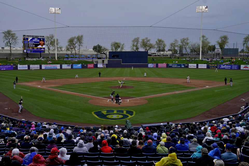 The Chicago White Sox and the Milwaukee Brewers compete during the third inning of a spring training baseball game, Tuesday, March 21, 2023, in Phoenix. (AP Photo/Matt York)