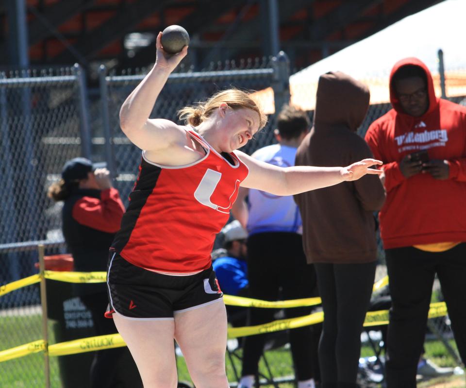 Utica's Katie Reed throws the shot put during Heath's Hank Smith Invitational on Saturday.