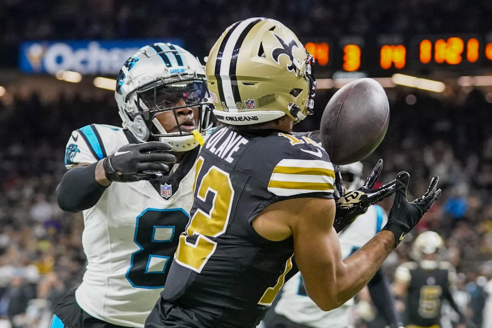 Carolina Panthers cornerback Jaycee Horn breaks up a pass intended for New Orleans Saints wide receiver Chris Olave during the second half of an NFL football game in New Orleans, Sunday, Dec. 10, 2023. (AP Photo/Gerald Herbert)