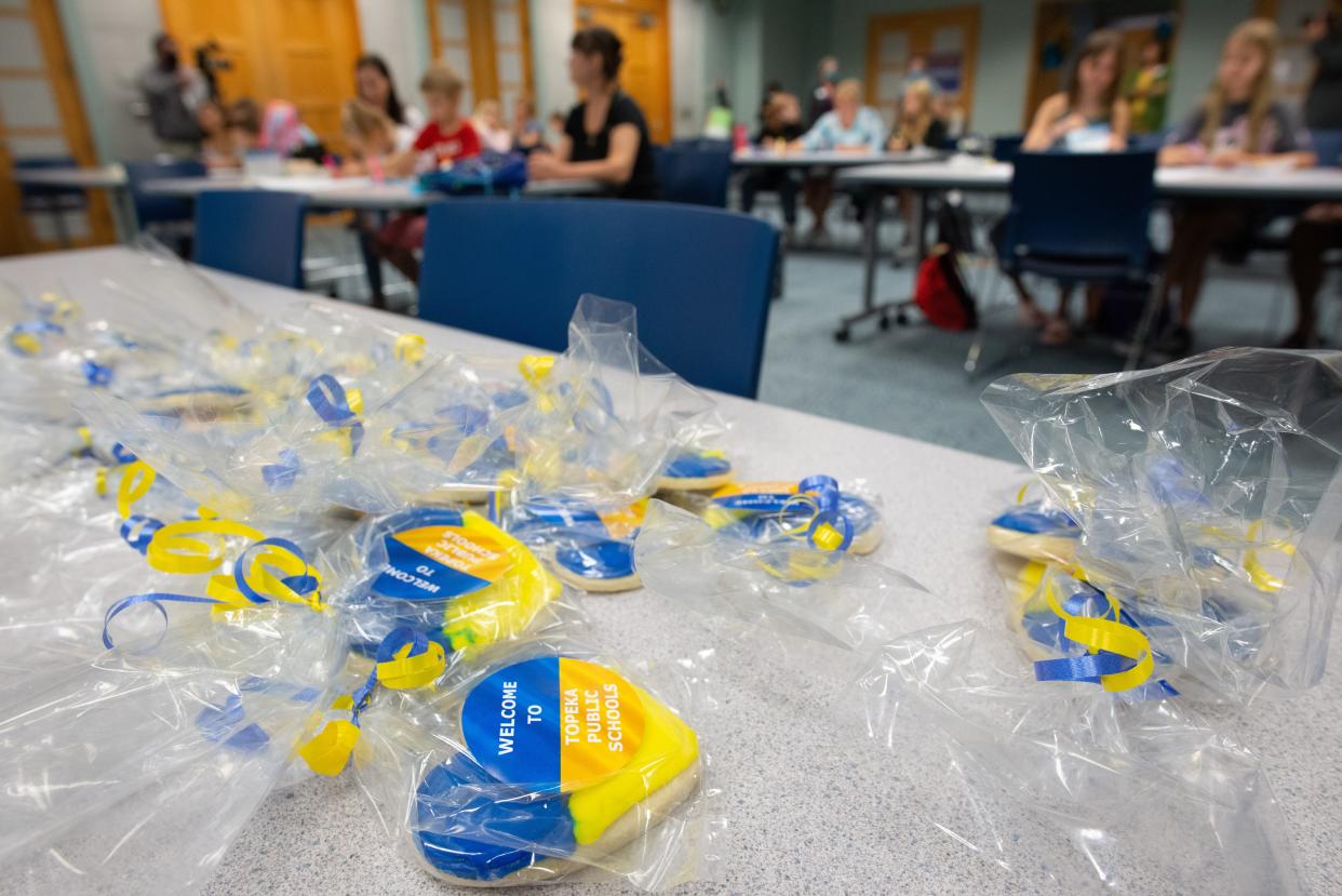 Heart-shaped cookies painted in the colors of the Ukrainian flag on Monday help to welcome refugee students who will soon attend Topeka USD 501 schools during an orientation event at the Topeka and Shawnee County Public Library.