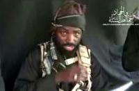 Boko Haram leader Abubakar Shekau makes a statement at an undisclosed location in video released on YouTube by Islamist group