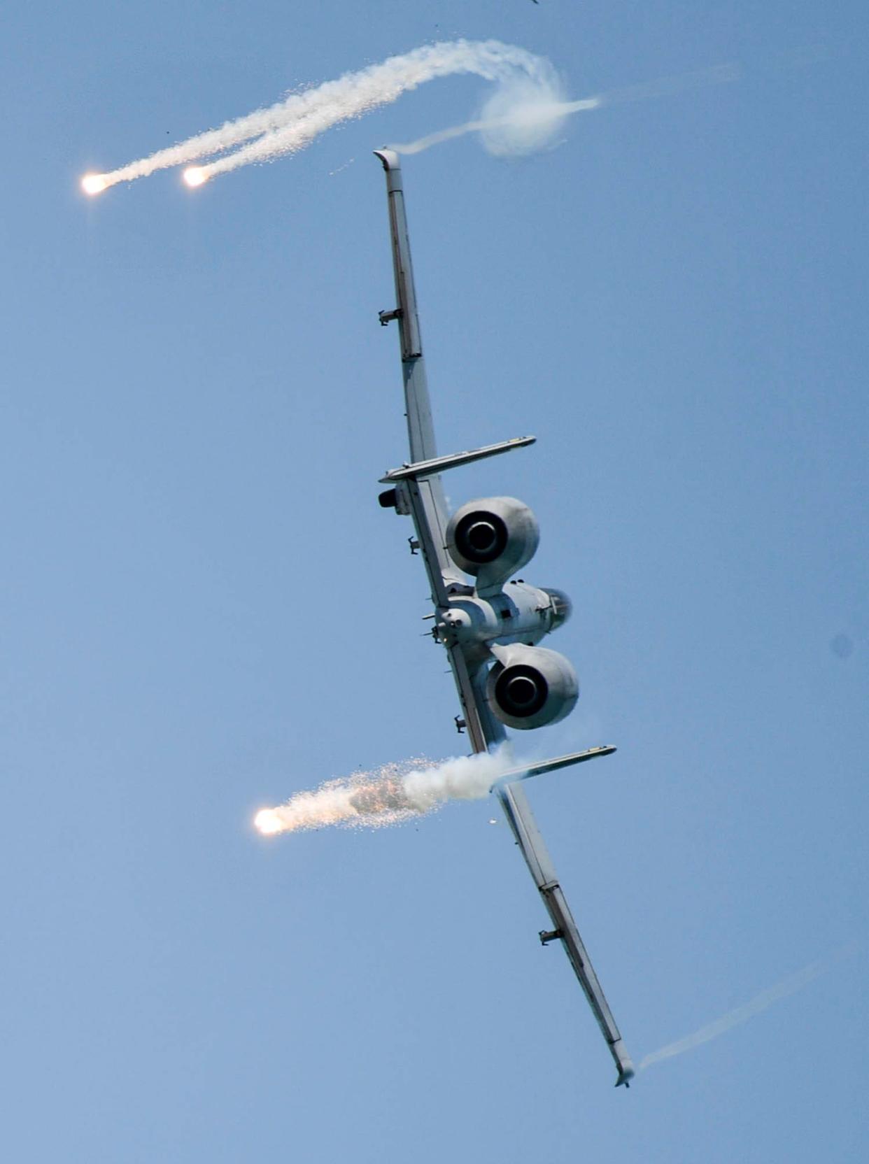 Capt. Lindsay “MAD” Johnson, flying the A-10 Thunderbolt II, fires off flares as she performs in the Cocoa Beach Air Show April 15 in Cocoa Beach, Fla. Johnson and her A-10C Thunderbolt II Demonstration Team will perform Saturday at the Wings Over Cannon air show at Cannon Air Force Base, N.M.