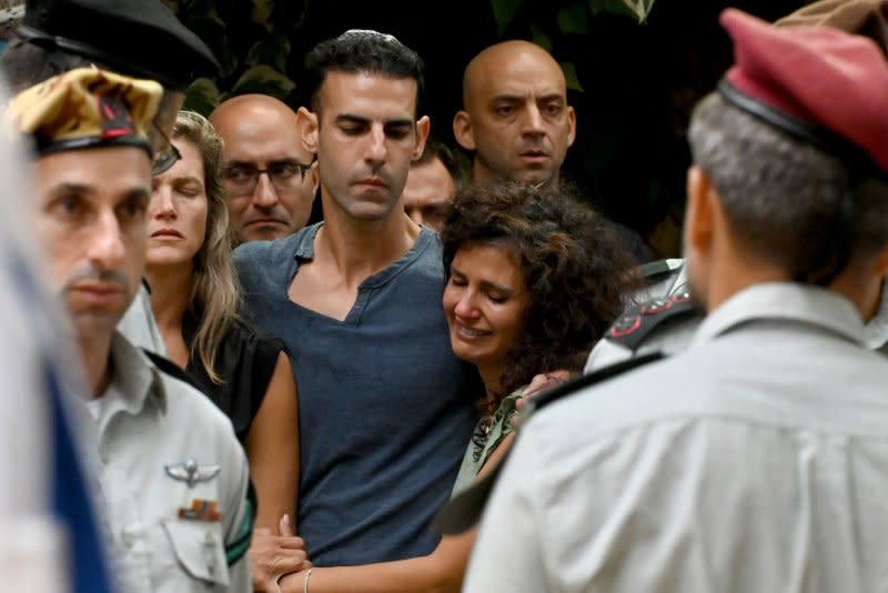 Family members mourn at the funeral of Col. Roi Levy, commander of the elite 'Ghost' multi-dimensional unit, in the Mt. Herzl Military Cemetery in Jerusalem, on Monday. He was married with five children. Photo by Debbie Hill/ UPI