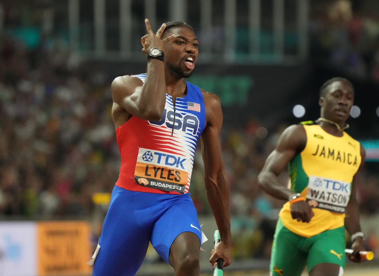 Noah Lyles celebrates after anchoring the U.S. team to victory in the men's 4x100 meter relay during the 2023 World Athletics Championships in Budapest.