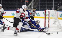 Sweden's goalie Jesper Wallstedt (1) makes the save on Switzerland's Fabian Ritzmann (19) during the third period of an IIHF world junior hockey championships game in Edmonton, Alberta on Wednesday, Aug. 10, 2022. (Jason Franson/The Canadian Press via AP)