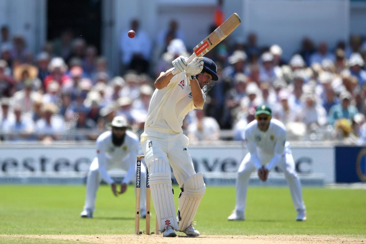 Take cover: Alastair Cook ducks away from a bouncer: Getty Images