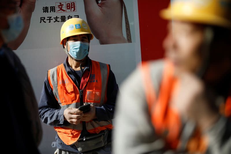 A construction worker wears a face masks following the coronavirus disease (COVID-19) outbreak, in Beijing