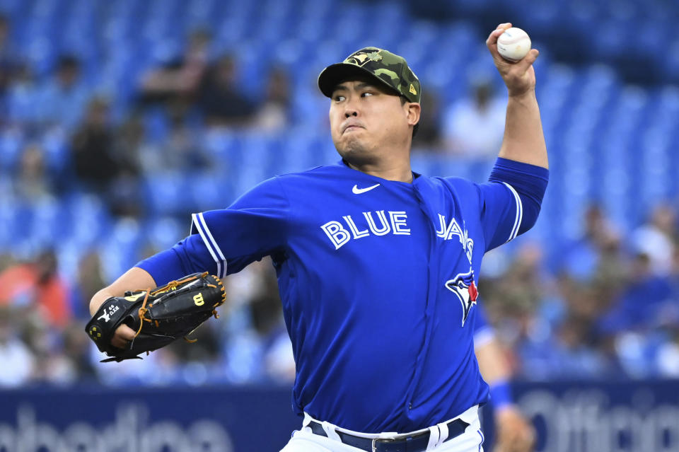 Toronto Blue Jays' Hyun Jin Ryu pitches to a Cincinnati Reds batter during the first inning of a baseball game Friday, May 20, 2022, in Toronto. (Jon Blacker/The Canadian Press via AP)