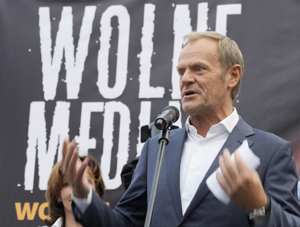 Donald Tusk, the leader of the Polish opposition party Civic Platform, speaks to a crowd of protesters in defense of media freedom in Warsaw, Poland, on Tuesday, Aug. 10, 2021. Poles demonstrated nationwide Tuesday against a bill widely viewed as a effort by the country's nationalist ruling party to silence an independent, U.S.-owned television broadcaster that is critical of the government.(AP Photo/Czarek Sokolowski)