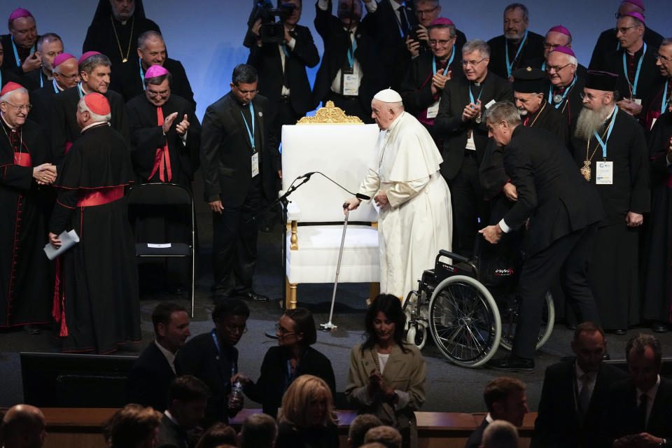 Pope Francis arrives at the final session of the "Rencontres Mediterraneennes" meeting at the Palais du Pharo, in Marseille, France, Saturday, Sept. 23, 2023. Francis, during a two-day visit, will join Catholic bishops from the Mediterranean region on discussions that will largely focus on migration. (AP Photo/Pavel Golovkin)