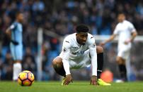 <p>Leroy Fer of Swansea City looks dejected after the full time whistle during the Premier League match between Manchester City and Swansea City at Etihad Stadium on February 5, 2017 in Manchester, England. </p>