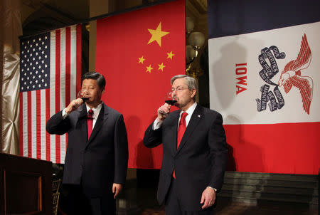 FILE PHOTO - China Vice President Xi Jinping (L) is welcomed by Iowa Governor Terry Branstad in the governor's office before the state dinner at the Iowa State Capitol in Des Moines, Iowa, U.S. February 15, 2012. REUTERS/Andrea Melendez/Pool/File Photo