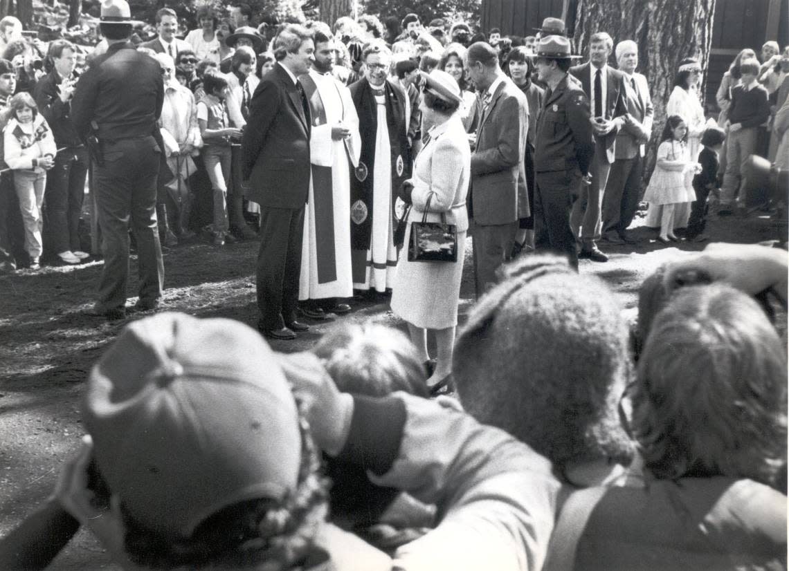 Queen Elizabeth II talks to the Rev. John C. Davis, in dark suit, after church services during her 1983 visit to Yosemite National Park. Others present: right, Rev. Victor M. Rivera, bishop of San Joaquin Valley Episcopal Diocese; center, Rod Craig, priest at Yosemite Park Church; left, Rev. John C. Davis, Presbyterian pastor at the Yosemite Community Church. Fresno Bee archive