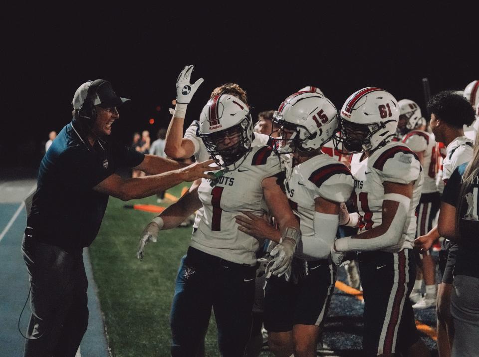 American Leadership Academy coach Ty Detmer celebrates with players during the 2023 season. | Josh Hemsley