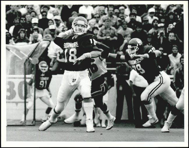 Troy Aikman (18) drops back to pass during OU's 27-14 loss to Miami on Oct. 19, 1985. The Sooners quarterback suffered a broken ankle in the game, paving the way to his transfer to UCLA and later a Hall of Fame career in the NFL. [OKLAHOMAN ARCHIVES]