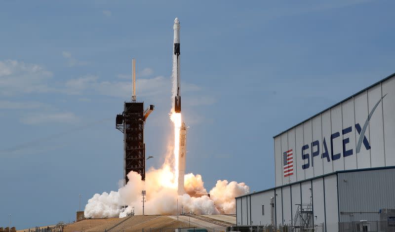 FILE PHOTO: A SpaceX Falcon 9 rocket and Crew Dragon spacecraft carrying NASA astronauts Douglas Hurley and Robert Behnken lifts off