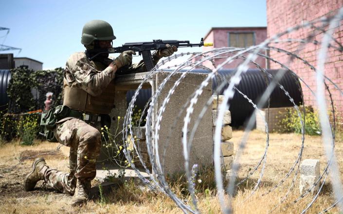 A Ukraine Army recruit takes part in a training session called &quot;The battle of Innoculation training&quot; with members of Britain&#39;s and other international partners&#39; armed forces personnel, at a Ministry of Defence