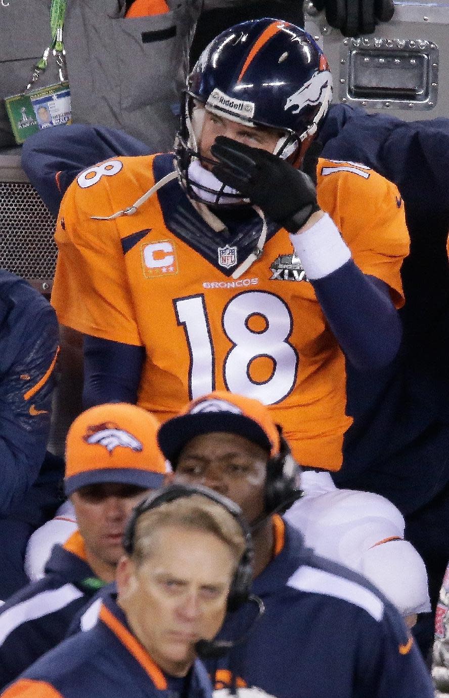 Denver Broncos' Peyton Manning watches play against the Seattle Seahawks during the second half of the NFL Super Bowl XLVIII football game Sunday, Feb. 2, 2014, in East Rutherford, N.J. (AP Photo/Charlie Riedel)