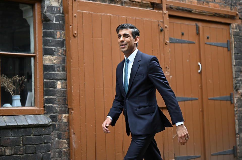 FILE - Britain's Chancellor of the Exchequer Rishi Sunak arrives for a regional cabinet meeting at Middleport Pottery in Stoke on Trent, England, Thursday, May 12, 2022. British Prime Minister Boris Johnson managed to see off a no-confidence vote from his own Conservative Party — but the result dealt a heavy blow to his authority, and questions are already being asked over who could succeed him. (Oli Scarff/Pool Photo via AP, File)