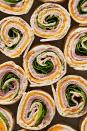 <p>Pinwheel sandwiches are here with their totally retro swirls, ready to be packed into <a href="https://www.delish.com/cooking/recipe-ideas/g3586/lunchbox-ideas/" rel="nofollow noopener" target="_blank" data-ylk="slk:lunchboxes;elm:context_link;itc:0;sec:content-canvas" class="link ">lunchboxes</a>, piled onto <a href="https://www.delish.com/entertaining/g1388/super-bowl-appetizers/" rel="nofollow noopener" target="_blank" data-ylk="slk:game day;elm:context_link;itc:0;sec:content-canvas" class="link ">game day</a> spreads, or just eaten as an afternoon <a href="https://www.delish.com/cooking/nutrition/g600/healthy-snacks-for-work/" rel="nofollow noopener" target="_blank" data-ylk="slk:snack;elm:context_link;itc:0;sec:content-canvas" class="link ">snack</a>. The best part is that there are endless combinations of fillings you can customize these with. As long as you stick with the basic formula and amounts, the sky's the limit.<br><br>Get the <strong><a href="https://www.delish.com/cooking/recipe-ideas/a42060498/pinwheel-sandwich-recipe/" rel="nofollow noopener" target="_blank" data-ylk="slk:Pinwheel Sandwiches recipe;elm:context_link;itc:0;sec:content-canvas" class="link ">Pinwheel Sandwiches recipe</a></strong>.</p>