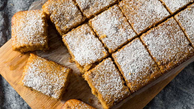 Cake made with applesauce with powdered sugar cut into squares