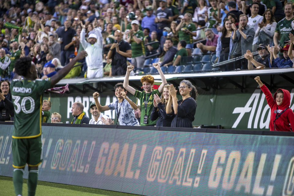 Portland Timbers fans celebrate after a goal by midfielder Santiago Moreno (31) against Real Salt Lake during the first half of an MLS soccer match Wednesday, Aug. 30, 2023, in Portland, Ore. (Sean Meagher/The Oregonian via AP)