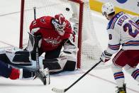 New York Rangers left wing Chris Kreider (20) scores a goal past Washington Capitals goaltender Vitek Vanecek (41) in the third period of an NHL hockey game, Wednesday, Oct. 13, 2021, in Washington. The Capitals won 5-1. (AP Photo/Alex Brandon)