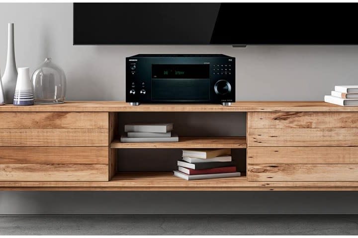 Onkyo TX-NR5100 on a shelf.