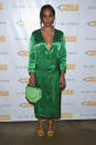 <p>For the evening, Solo was hard to be missed in a shiny green wrap-effect dress, yellow Stuart Weitzman sandals, and a lighter green M2malletier bag. <i>(Photo: Getty)</i></p>