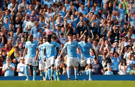Britain Soccer Football - Manchester City v Arsenal - Barclays Premier League - Etihad Stadium - 8/5/16 Kevin De Bruyne celebrates with team mates after scoring the second goal for Manchester City Action Images via Reuters / Jason Cairnduff Livepic