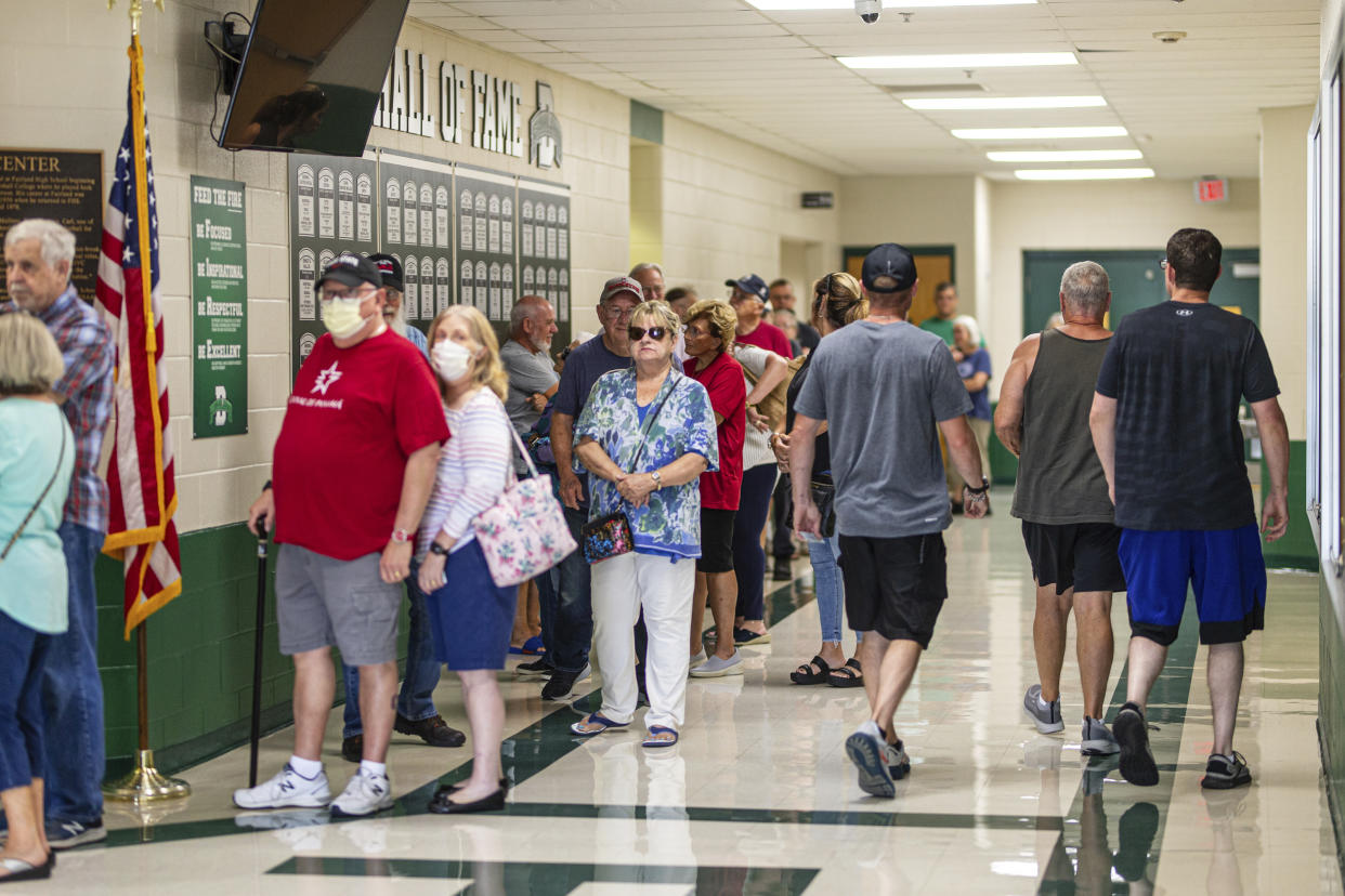 Lawrence County residents line the halls to vote at Fairland High School, Tuesday, Aug. 8, 2023, in Proctorville, Ohio. Voters in Ohio on Tuesday are weighing whether to make it more difficult to change the state's constitution, a decision that will have national implications in the debate over the future of abortion rights in the United States. (Sholten Singer/The Herald-Dispatch via AP)