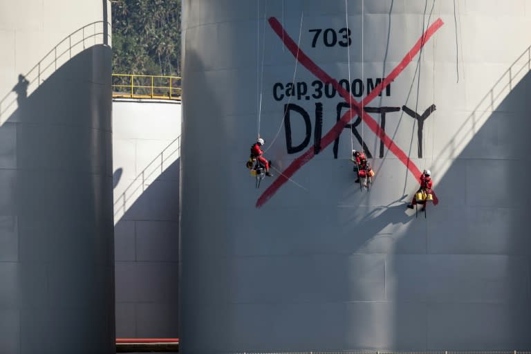 Activists also painted 'Dirty' on storage tanks owned by Singapore-listed Wilmar International, the world's biggest palm oil trader which supplies major brands including Colgate, Nestlé and Unilever