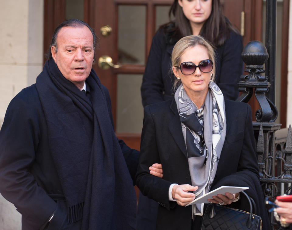 NEW YORK, NY - NOVEMBER 03:  Julio Iglesias and wife Miranda Rijnsburger depart the funeral of fashion designer Oscar De La Renta at St. Ignatius Of Loyola on November 3, 2014 in New York City.   at St. Ignatius Of Loyola on November 3, 2014 in New York City.  (Photo by Dave Kotinsky/Getty Images)