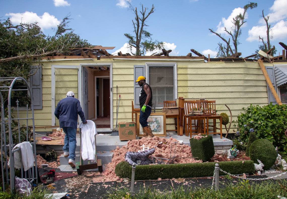 Family members help clean up the home of Evelyn Powell, an Edgecombe County Commissioner, Thursday, July 20, 2023 in Battleboro. An EF3, tornado with wind speeds of 150 mph touched down in Nash and Edgecombe Counties around 12:30 p.m. Wednesday according to the Raleigh National Weather Service. Travis Long/tlong@newsobserver.com