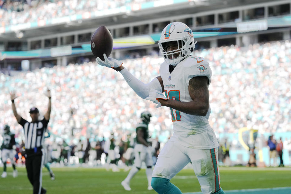 Miami Dolphins wide receiver Jaylen Waddle (17) scores a touchdown during the first half of an NFL football game against the New York Jets, Sunday, Dec. 17, 2023, in Miami Gardens, Fla. (AP Photo/Rebecca Blackwell)