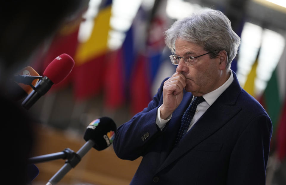 European Commissioner for Economy Paolo Gentiloni speaks with the media as he arrives for a meeting of eurogroup finance ministers at the European Council building in Brussels, Monday, Jan. 17, 2022. Euro finance chiefs hold their first meeting of 2022 in Brussels today facing a challenge that spilled over from last year: surging prices. Inflation in the 19-nation euro area has risen to a record amid an energy-market squeeze while the economic outlook for Europe has dimmed following a recovery in 2021 from the pandemic-induced recession. (AP Photo/Virginia Mayo)