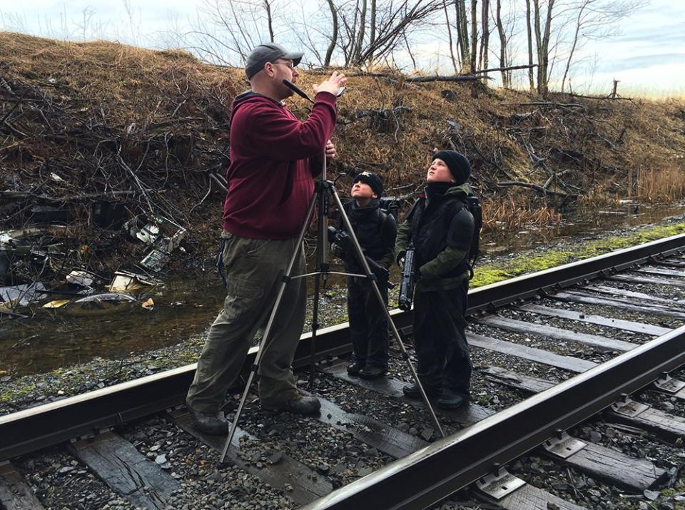 Brian frames the shot of his ‘action hero’ sons (Brian Vowles/PA)