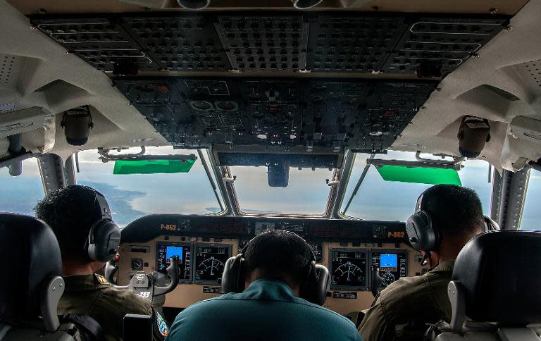 Indonesian Army personnel keep watch during the search for missing AirAsia flight QZ8501, over the waters of the Java Sea on December 29, 2014